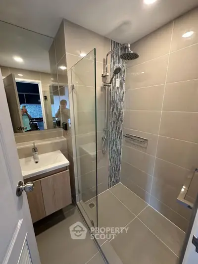 Modern bathroom with sleek shower design and stylish tiles