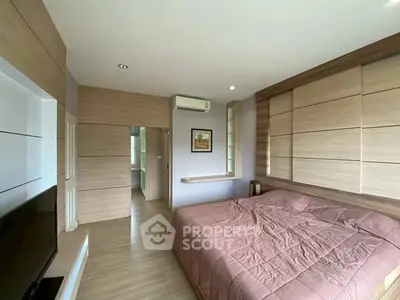 Modern bedroom with wooden accents and large bed in stylish apartment