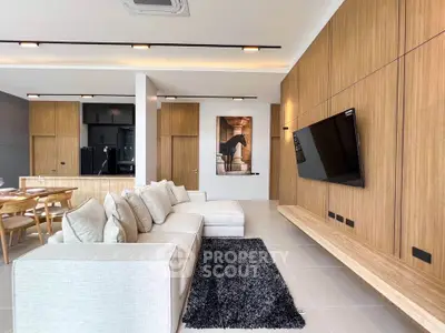 Modern living room with stylish decor and open kitchen layout