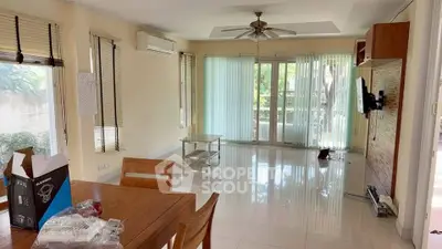 Spacious living room with large windows and modern decor