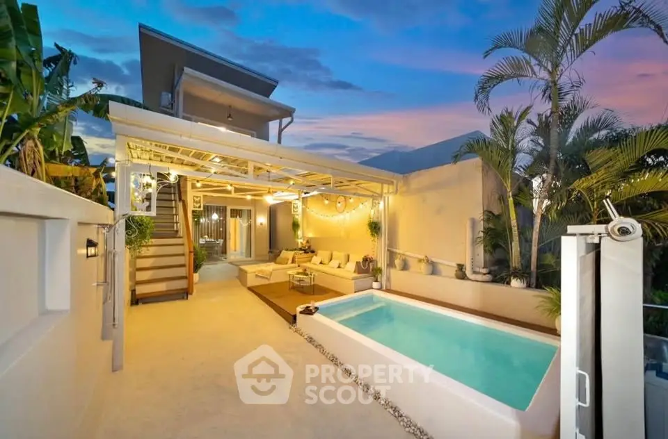 Luxurious modern home with private pool and stylish outdoor lounge area at sunset.