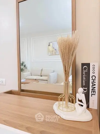 Stylish interior with elegant decor and modern furniture, featuring a cozy living room reflection.