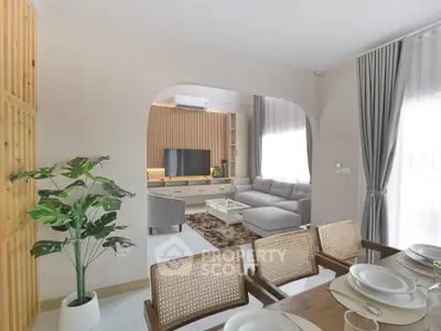 Modern living room with stylish decor and open dining area