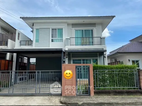 Charming two-story house with modern design and spacious driveway in a serene neighborhood.