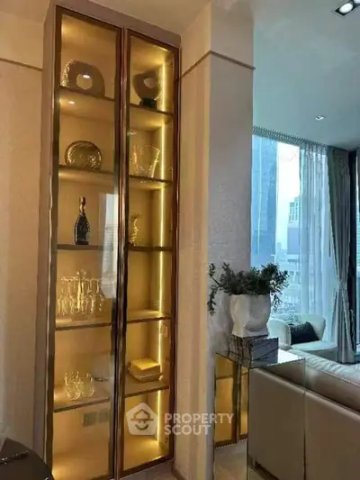 Luxurious living room with elegant glass display cabinet and city view