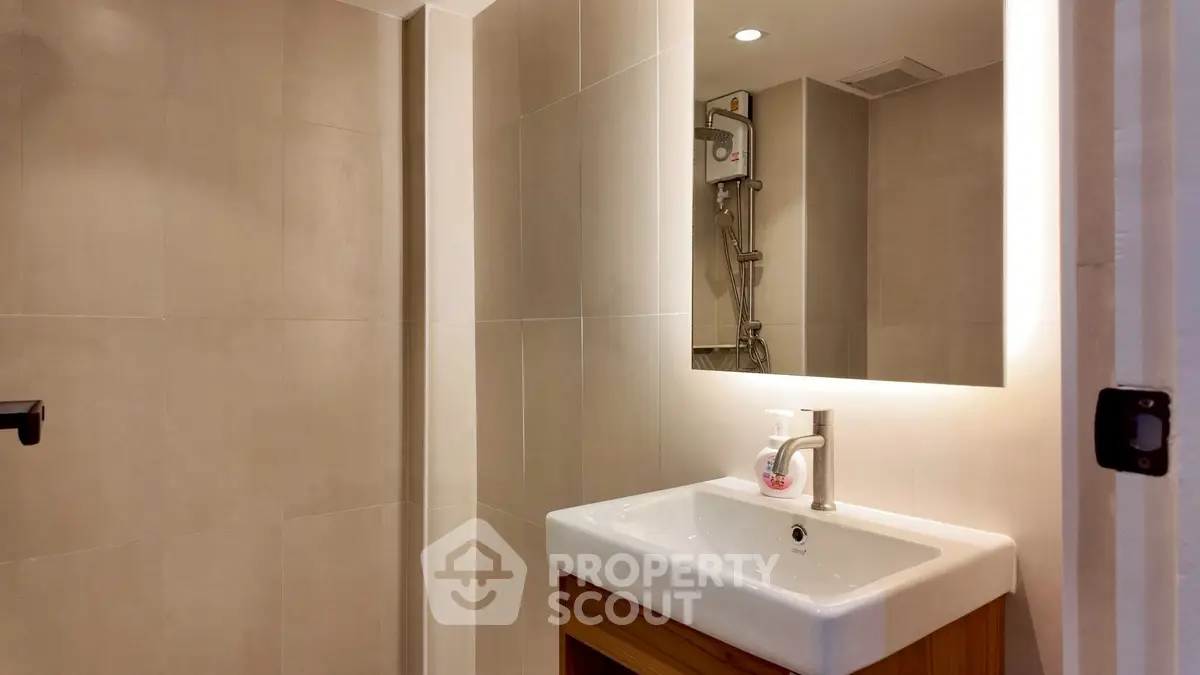 Modern bathroom with sleek fixtures and neutral tile design