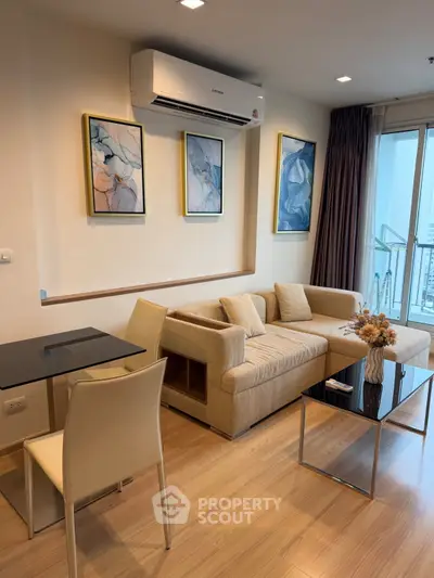 Modern living room with stylish decor and city view balcony