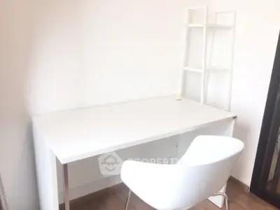 Minimalist study room with sleek white desk and modern chair, perfect for productivity.