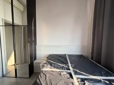 Modern bedroom with mirrored wardrobe and minimalist design