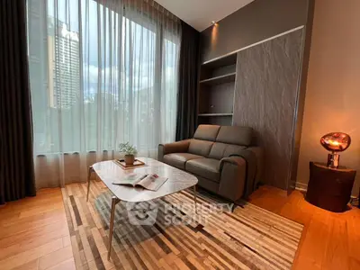 Modern living room with stylish furniture and large window view