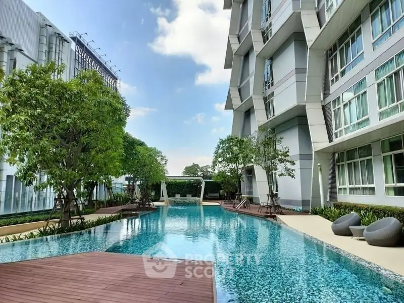 Luxurious modern apartment with stunning pool and lush greenery