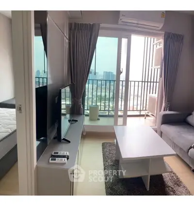 Modern living room with balcony view in high-rise apartment