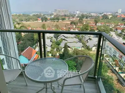 Stunning balcony view overlooking cityscape and greenery, perfect for relaxation.