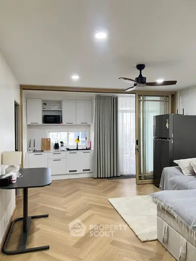 Modern studio apartment with open kitchen and cozy living area