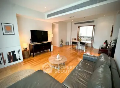 Spacious modern living room with wooden flooring and stylish decor