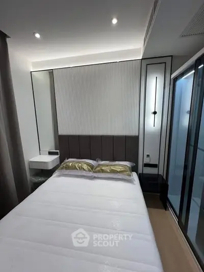 Modern bedroom with sleek design and elegant lighting