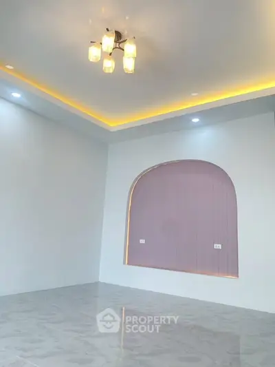 Modern living room with elegant lighting and unique wall design