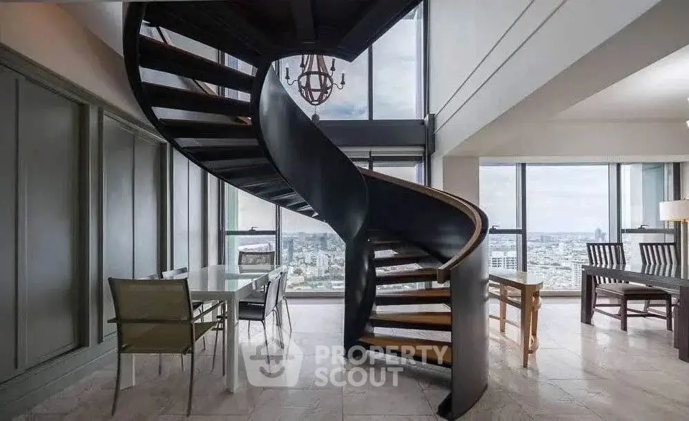 Luxurious penthouse with stunning spiral staircase and panoramic city views