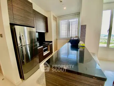 Modern kitchen with sleek dark wood cabinets and stainless steel appliances