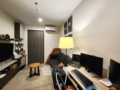 Cozy living room with modern decor and workspace setup