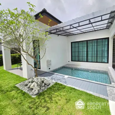 Modern villa with private pool and lush garden, perfect for luxury living.