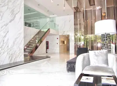 Luxurious modern living room with marble floors and elegant decor