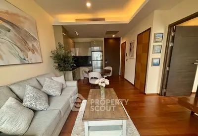 Modern living room with cozy seating and stylish decor in a contemporary apartment.