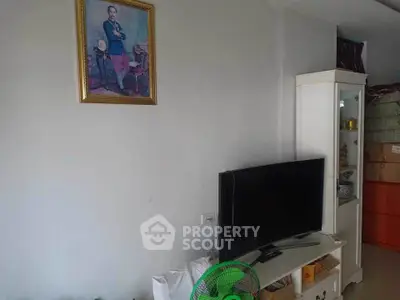 Cozy living room with modern TV setup and elegant wall art