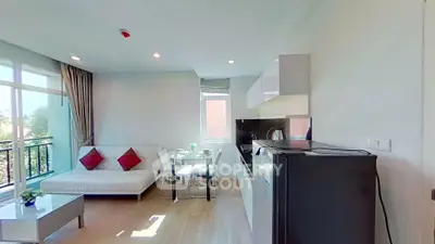 Modern living room with open kitchen and natural light