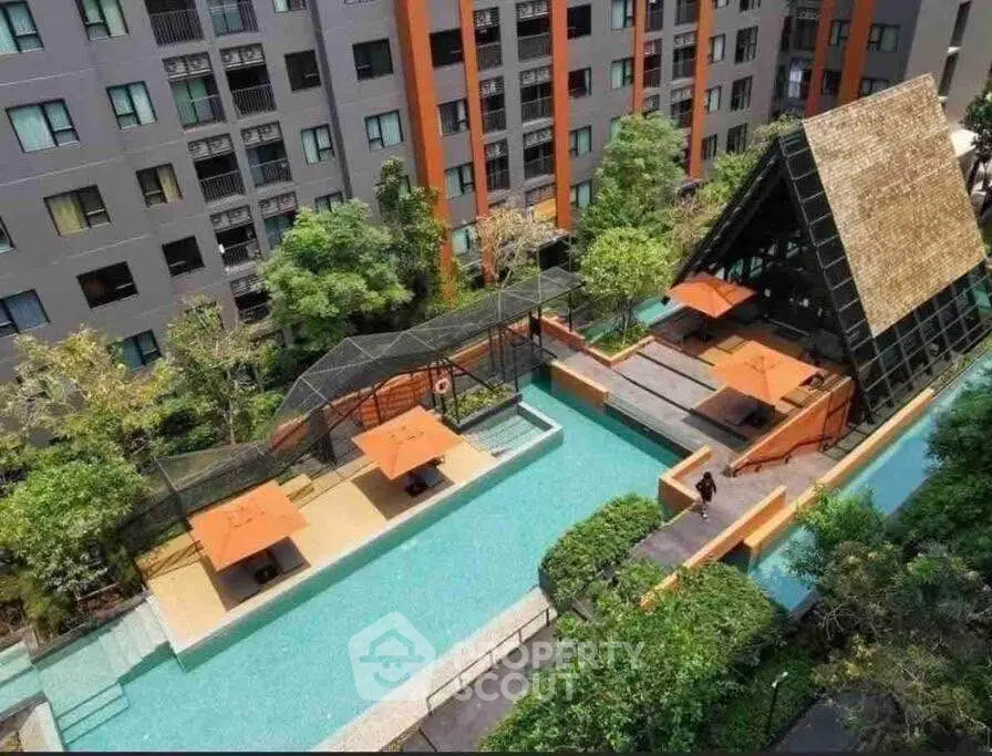 Luxurious apartment complex with stunning pool and modern architecture