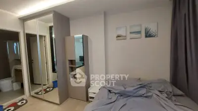 Cozy bedroom with mirrored closet and modern decor