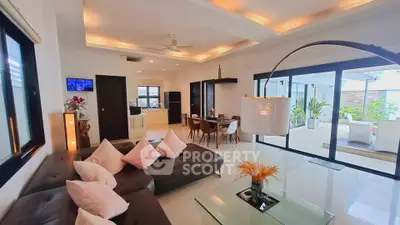 Spacious modern living room with open layout and large windows for natural light.