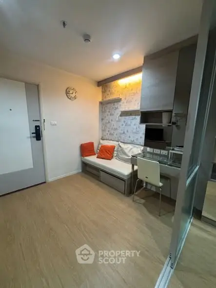 Cozy modern living room with stylish decor and compact design, perfect for urban living.