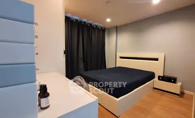 Modern bedroom with sleek design and cozy ambiance, featuring a stylish bed and contemporary furniture.