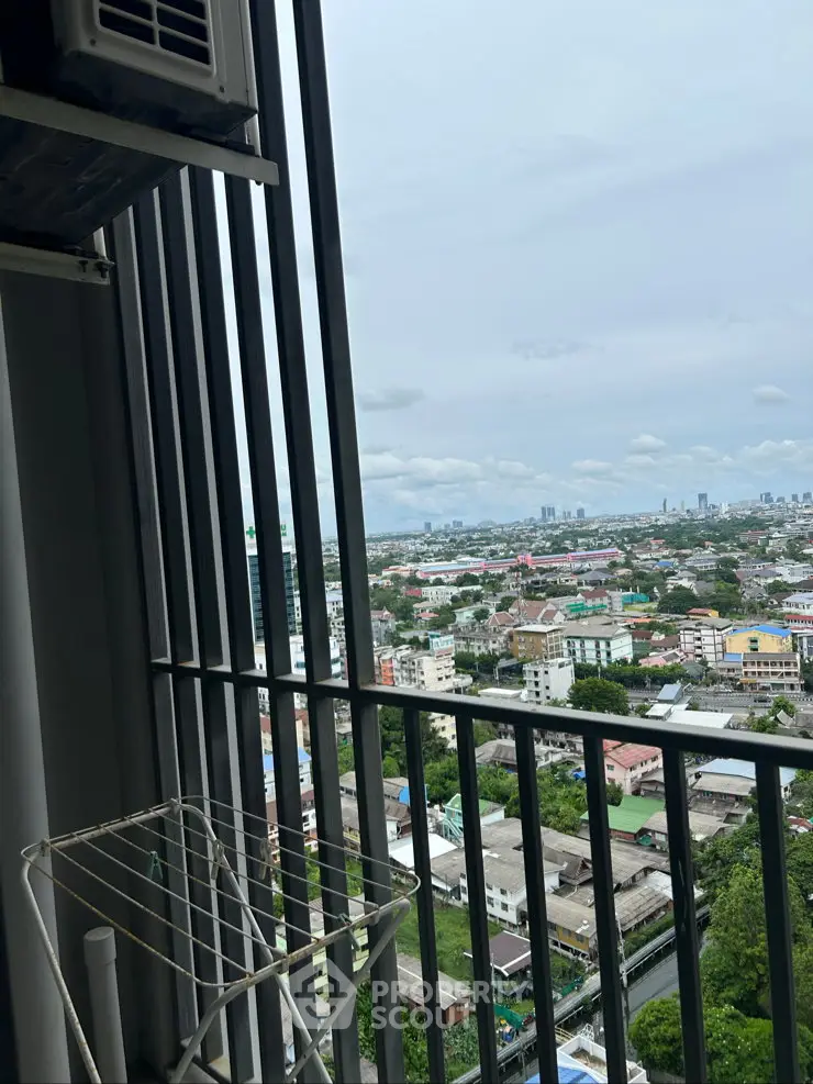 Stunning cityscape view from high-rise balcony with expansive skyline and urban landscape.