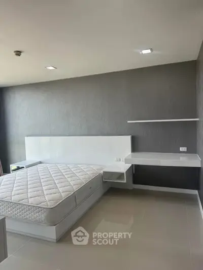 Modern minimalist bedroom with sleek design and neutral tones