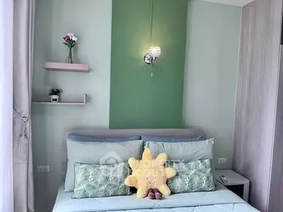 Charming bedroom with pastel green accents and cozy decor