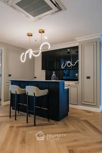 Modern interior with stylish bar counter and elegant lighting in a chic living space.