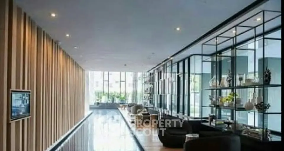 Luxurious modern lobby with sleek design and elegant decor in upscale building.