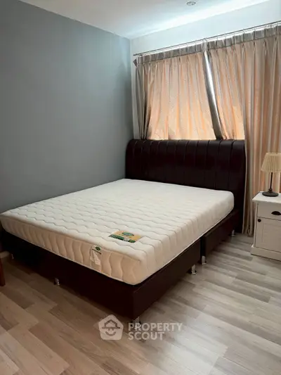 Cozy bedroom with elegant bed and natural light through curtains