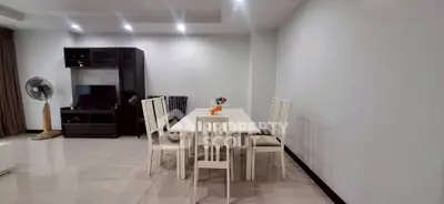 Spacious modern living room with dining area and entertainment center