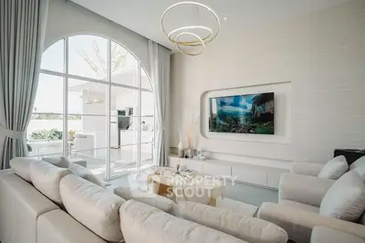 Luxurious modern living room with elegant decor and large window view