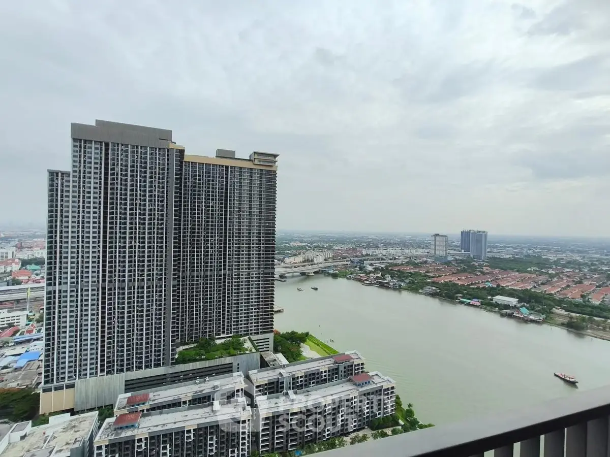 Stunning high-rise riverfront view from a modern apartment balcony