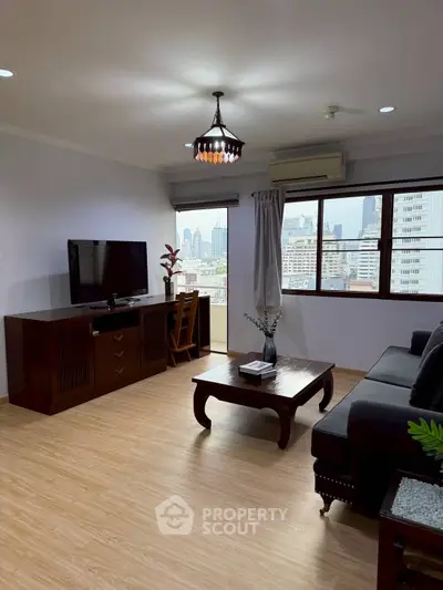 Stylish living room with city view, elegant furniture, and natural light.