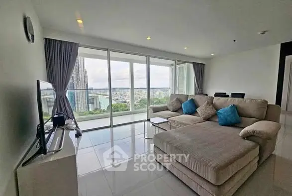 Spacious living room with panoramic city view and modern decor