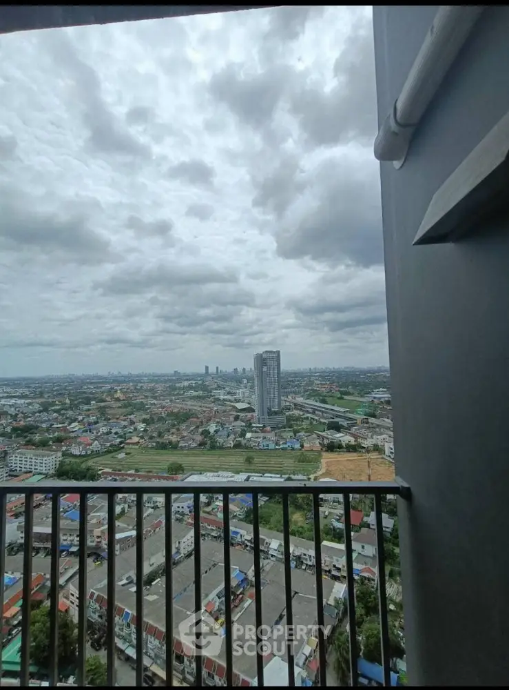 Stunning cityscape view from high-rise balcony with expansive skyline and urban landscape.