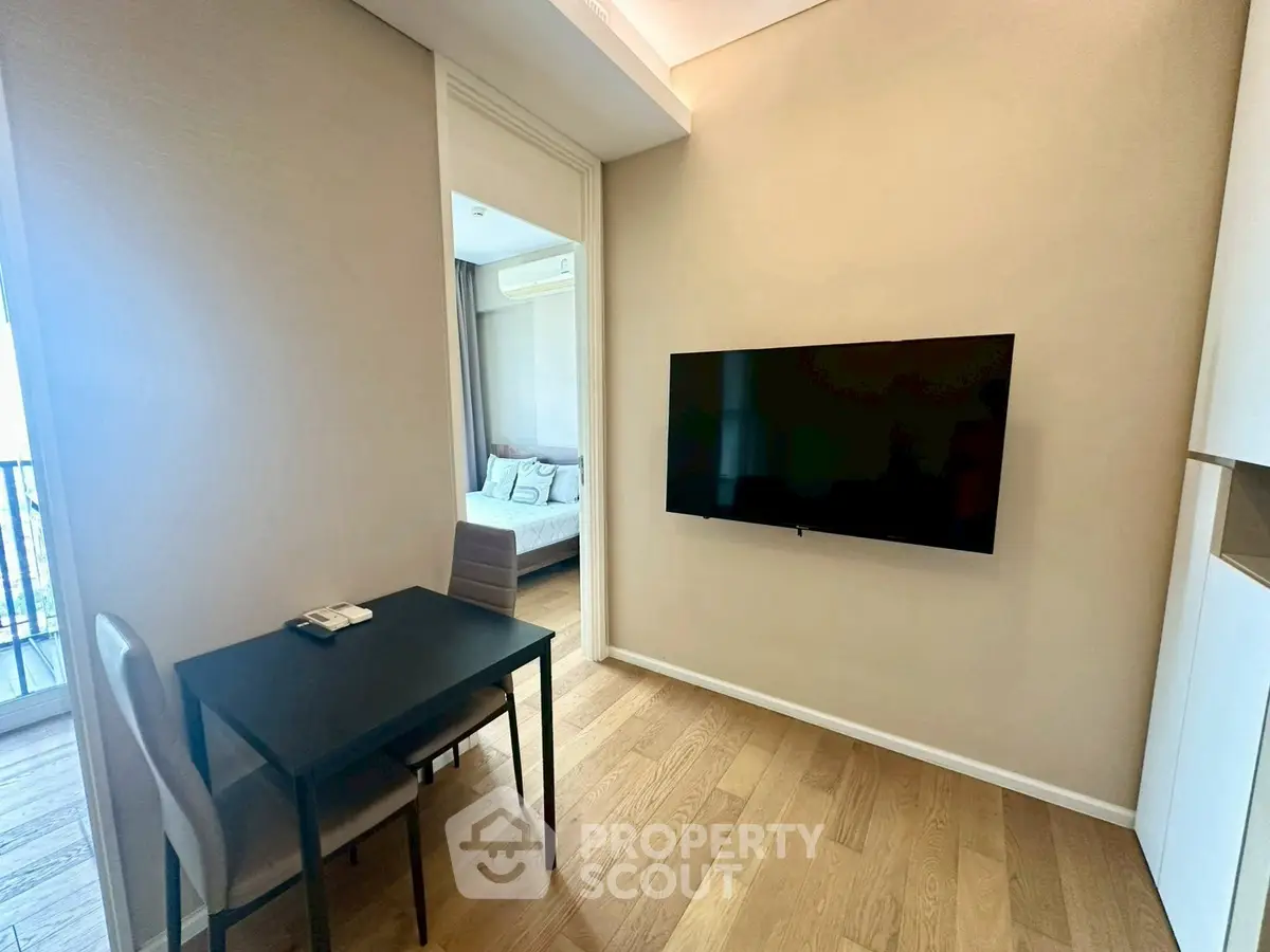 Modern study area with wall-mounted TV and sleek furniture