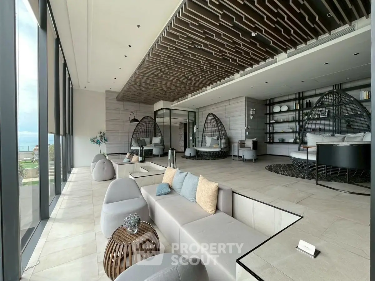 Luxurious modern living room with panoramic ocean view and stylish decor