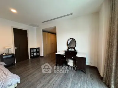 Spacious bedroom with elegant vanity and ample closet space