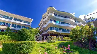 Stunning modern building with lush gardens and unique architectural design.